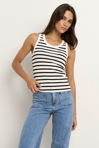 model wears a white black stripe tank top