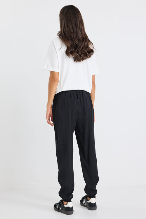 model wears a black drawstring jogger