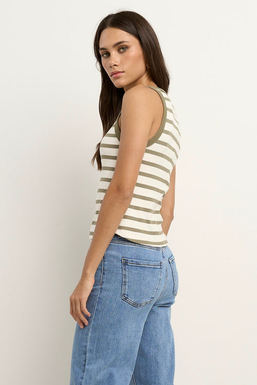 model wears a white and khaki stripe tank