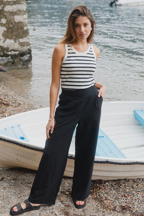 model wears a white black stripe tank top