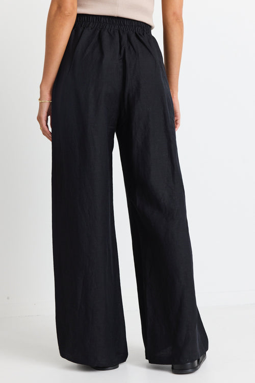 model wears black linen pants