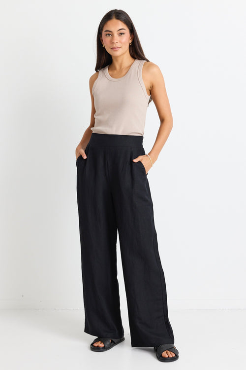 model wears black linen pants