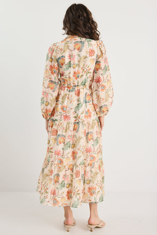 Woman wearing a floral dress on a white background