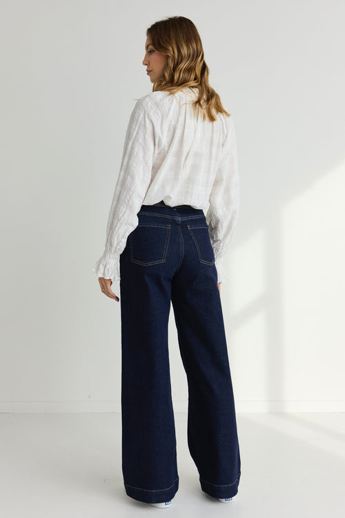 model wears a White Long Sleeve Blouse