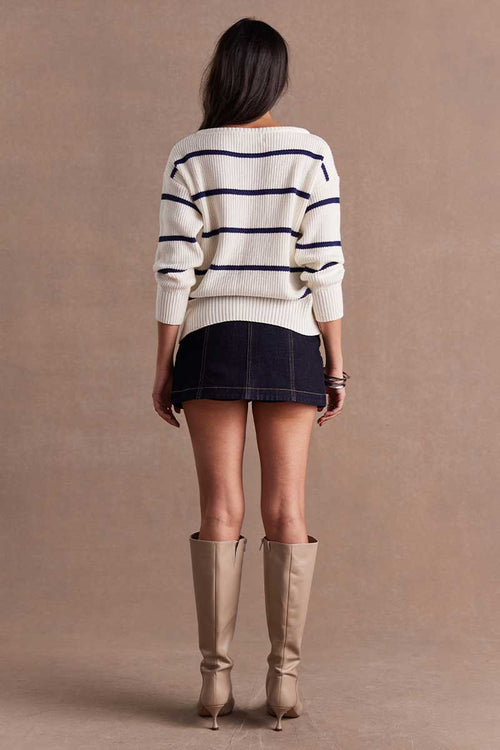 model wears a White Black Stripe Sweater