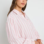 Model wears pink strip shirt