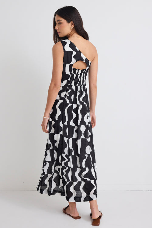 model wears a one shoulder black and white print dress