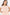 Woman wearing a peach-colored dress with thin white stripes on a white background