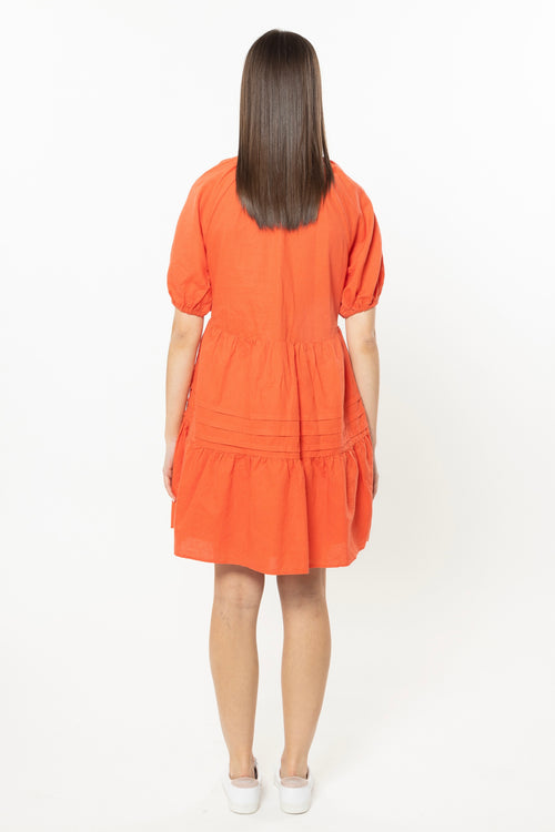 model wears orange Linen Mini Dress
