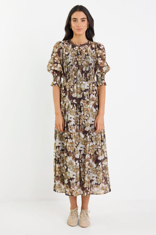 Woman wearing a floral dress on a white background