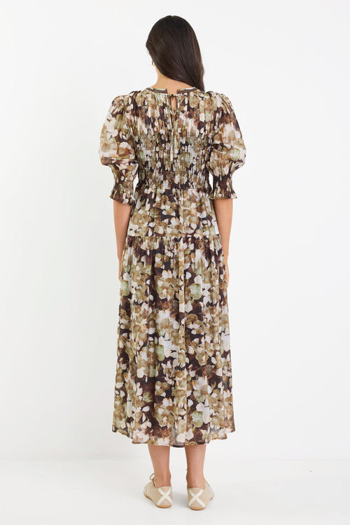 Woman wearing a floral dress on a white background