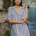 model wears blue and white stripe midi dress