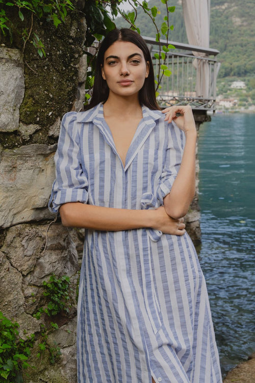 model wears blue and white stripe midi dress