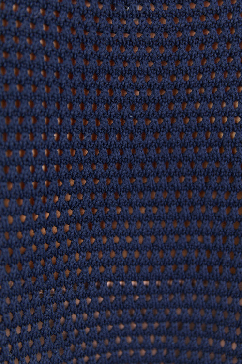 Close-up of a textured blue fabric with a subtle pattern