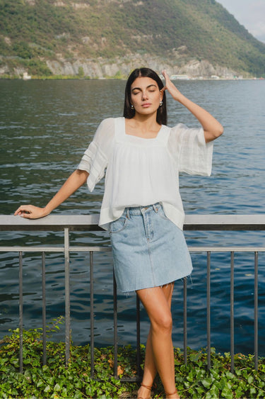 model wears a denim mini skirt