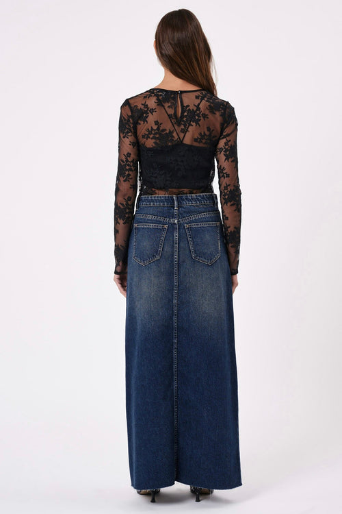 model wears a maxi denim skirt