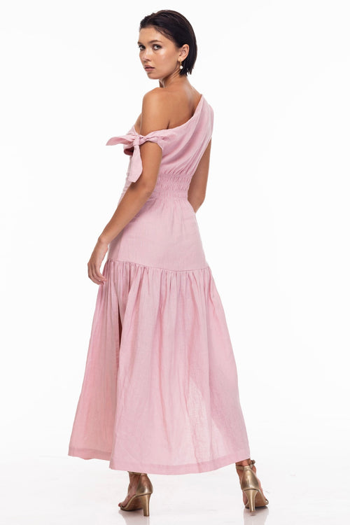 model wears a pink one shoulder maxi dress