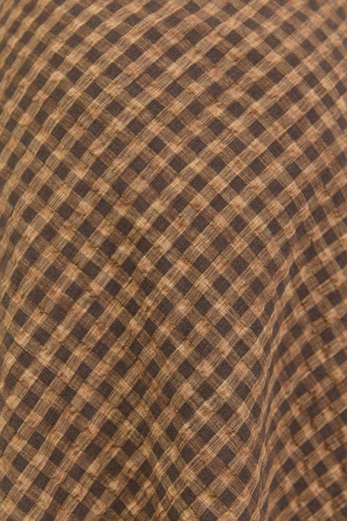 Brown checkered fabric close up.