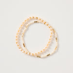 Cream and gold double beaded bracelet featuring mixed ivory beads and metallic gold accents, styled in a layered loop on a white background. Delicate women’s jewellery ideal for stacking, gifting and everyday wear.