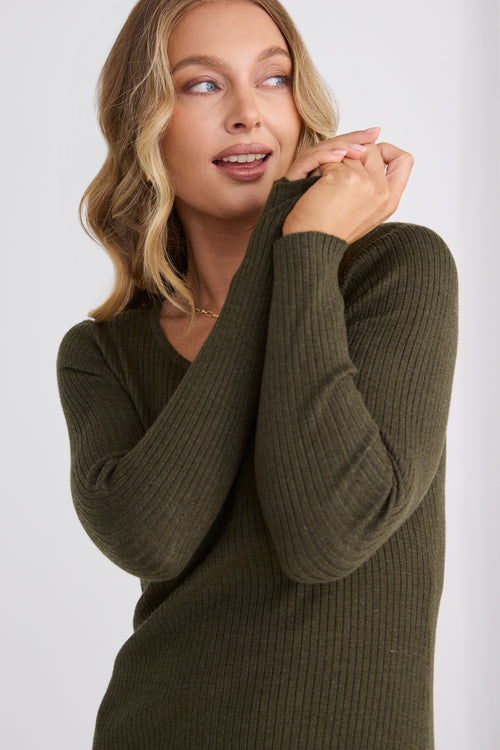 model wears a green rib knit midi dress