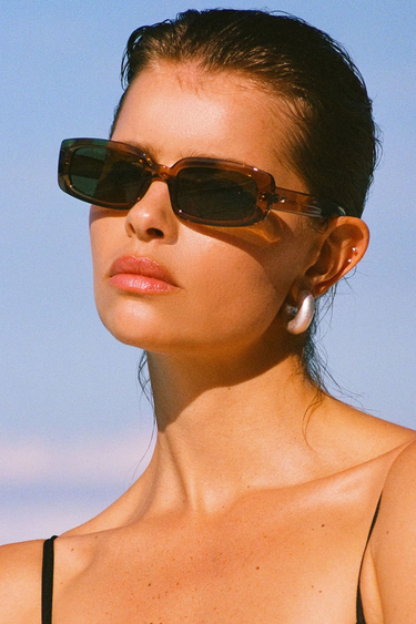 model wears Rectangle Tobacco Brown Sunglasses