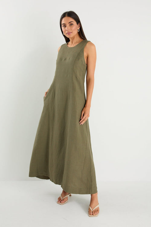 model wearing green linen dress