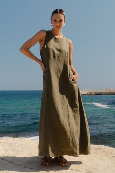 model wearing green linen dress
