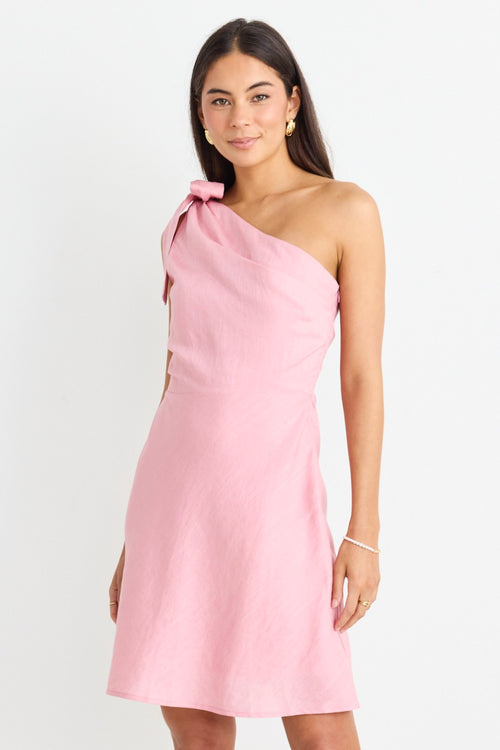 model wears a one shoulder pink mini dress