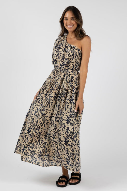 model wears a navy floral one shoulder maxi dress