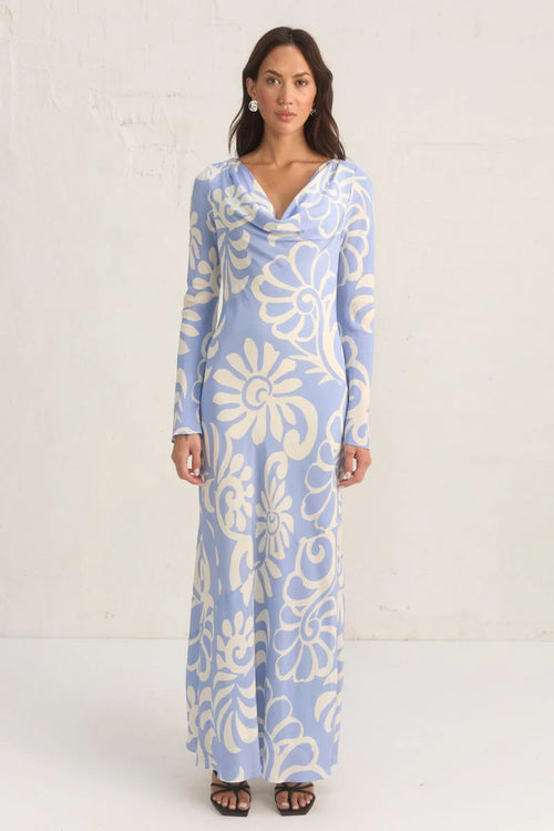 Model wears a blue long sleeve floral print maxi dress