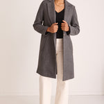 model wears a Grey Wool Coat 