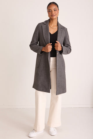 model wears a Grey Wool Coat 