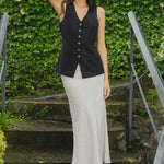 model wears black linen vest