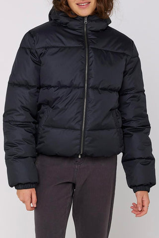 model wears a black puffer jacket