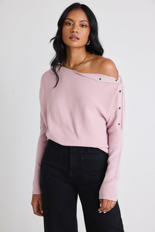 Model wears a pink batwing jumper