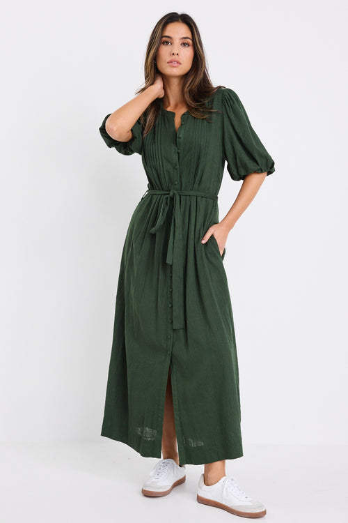 Woman wearing a forest green short sleeve midi shirt dress with puff sleeves, button front and waist tie.