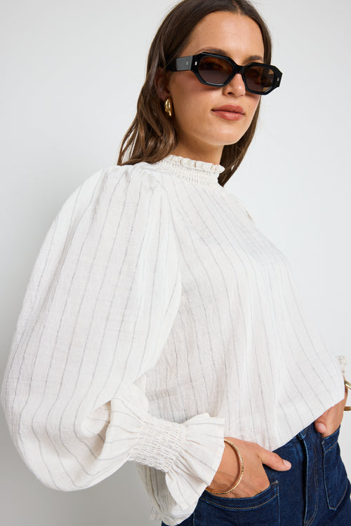 Long-sleeve top features a flattering high neckline and a relaxed silhouette for ultimate ease.