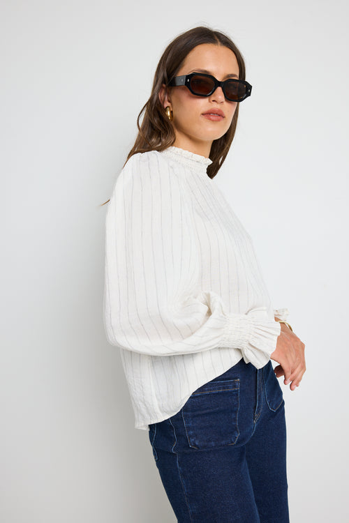 Long-sleeve top features a flattering high neckline and a relaxed silhouette for ultimate ease.