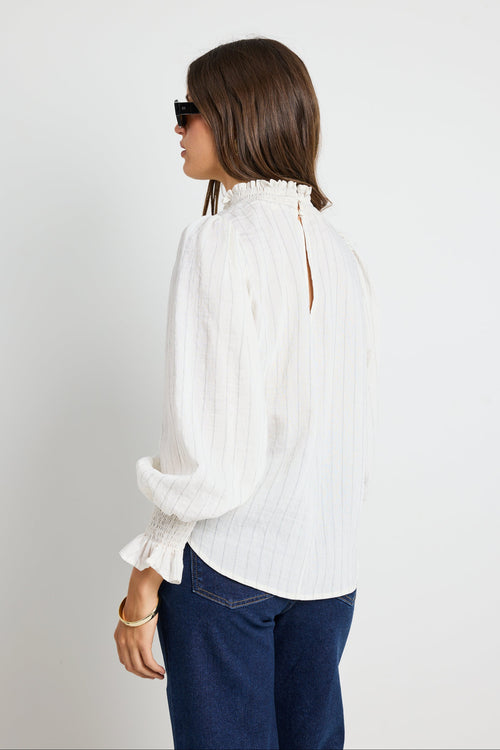 Long-sleeve top features a flattering high neckline and a relaxed silhouette for ultimate ease.