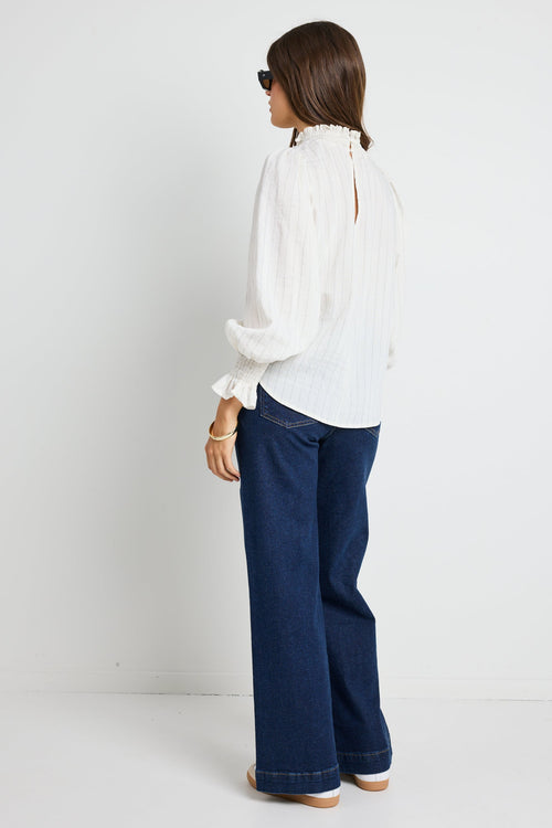 Long-sleeve top features a flattering high neckline and a relaxed silhouette for ultimate ease.