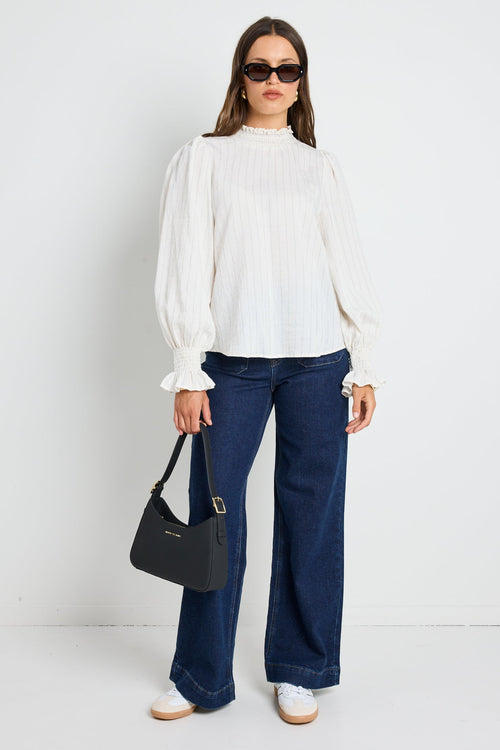 Long-sleeve top features a flattering high neckline and a relaxed silhouette for ultimate ease.