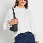 Long-sleeve top features a flattering high neckline and a relaxed silhouette for ultimate ease.