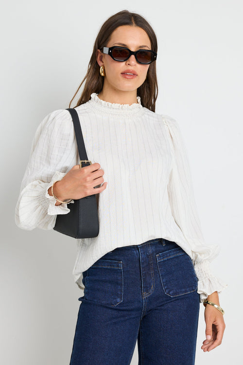 Long-sleeve top features a flattering high neckline and a relaxed silhouette for ultimate ease.