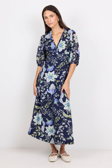 Woman wearing a floral dress on a white background