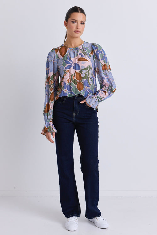 model wears a blue floral blouse