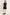 model wears a black button up mini dress with sneakers