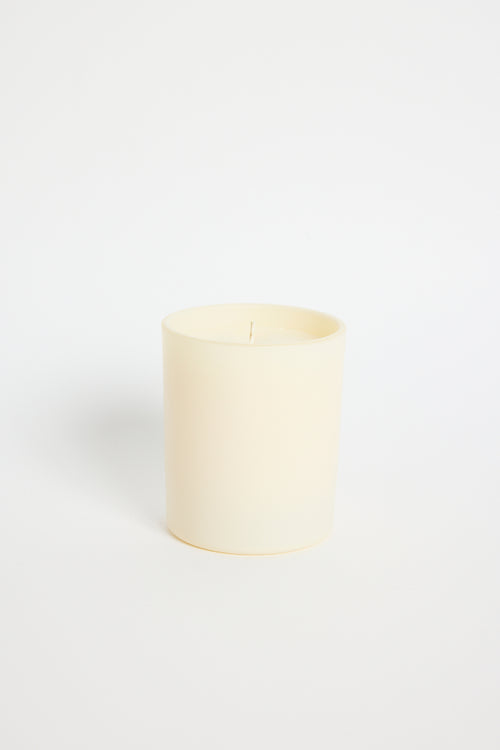 White candle on a white background