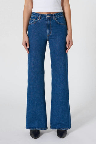model wears blue jeans