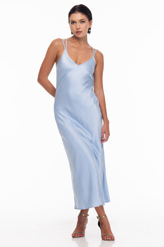 model wears a blue slip dress