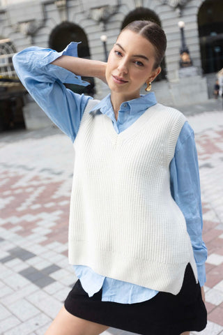 model wears a white knit vest